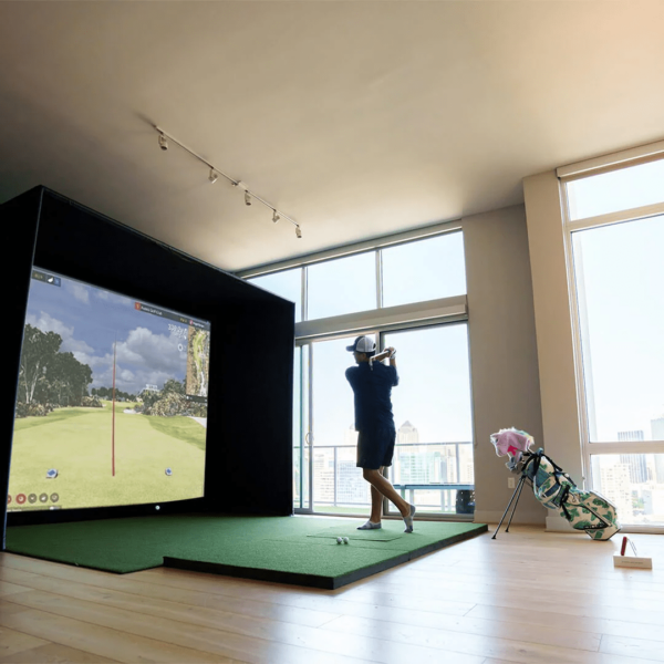 golfer hitting into a sig10 golf simulator with flightscope mevo plus launch monitor